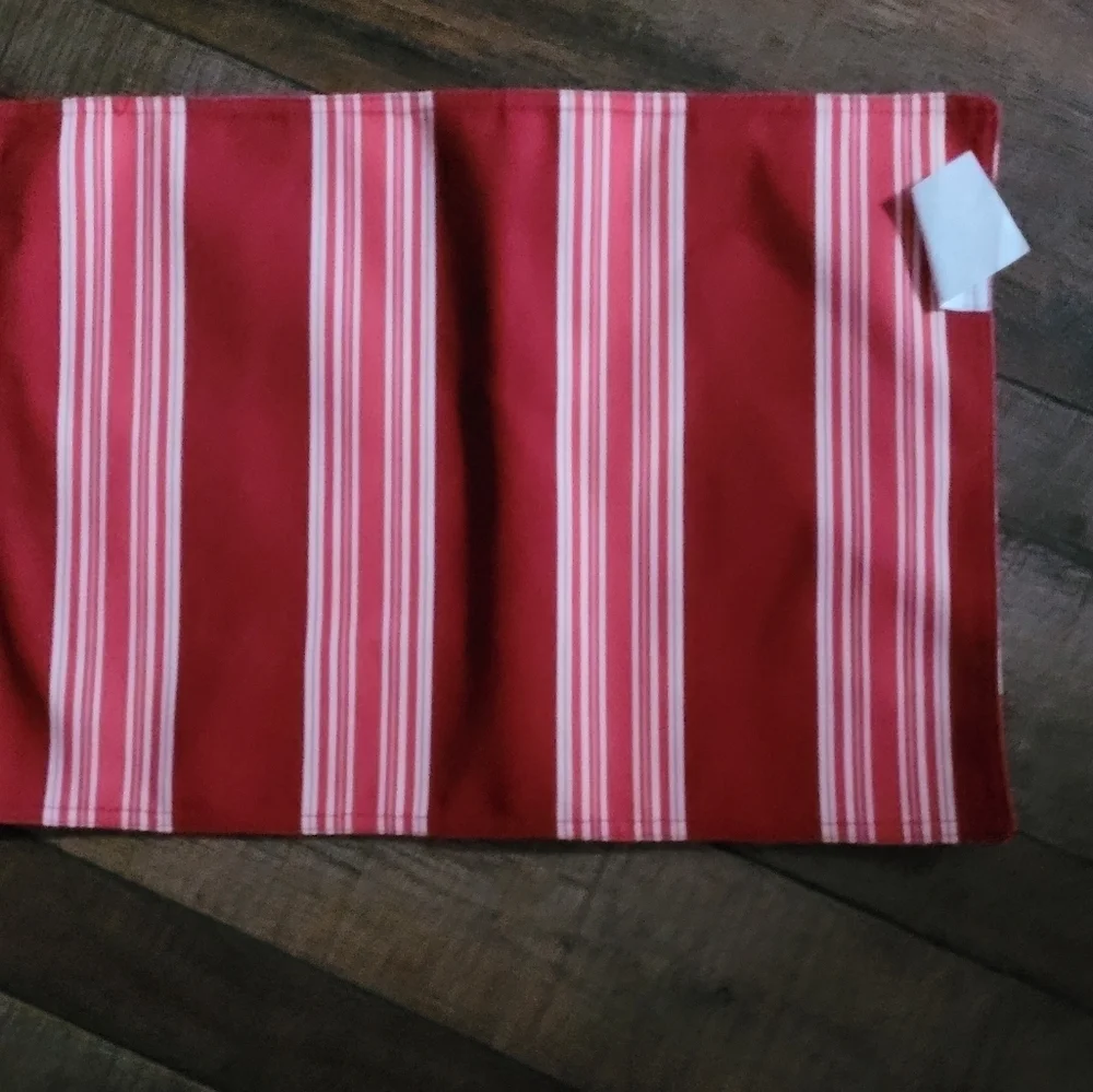 2 red and white place mats.